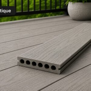 Antique WPC Hollow Decking board in a grey woodgrain finish rests on matching composite decking beside a railing and planter on a balcony.
