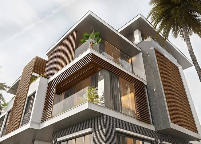 Premium Outdoor WPC Wall Panels in Sydney: Stylish, Weatherproof & Built to Last 5 Modern house exterior with premium WPC wall panels, timber-look slats, glass balconies and a palm tree.